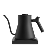 Matte black electric kettle with curved gooseneck spout and ergonomic handle on square base.