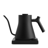 Matte black electric kettle with a gooseneck spout and angled handle on a square base.