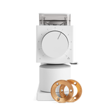 White rectangular coffee grinder with large front dial, clear bean hopper, and wooden burrs displayed beside it.