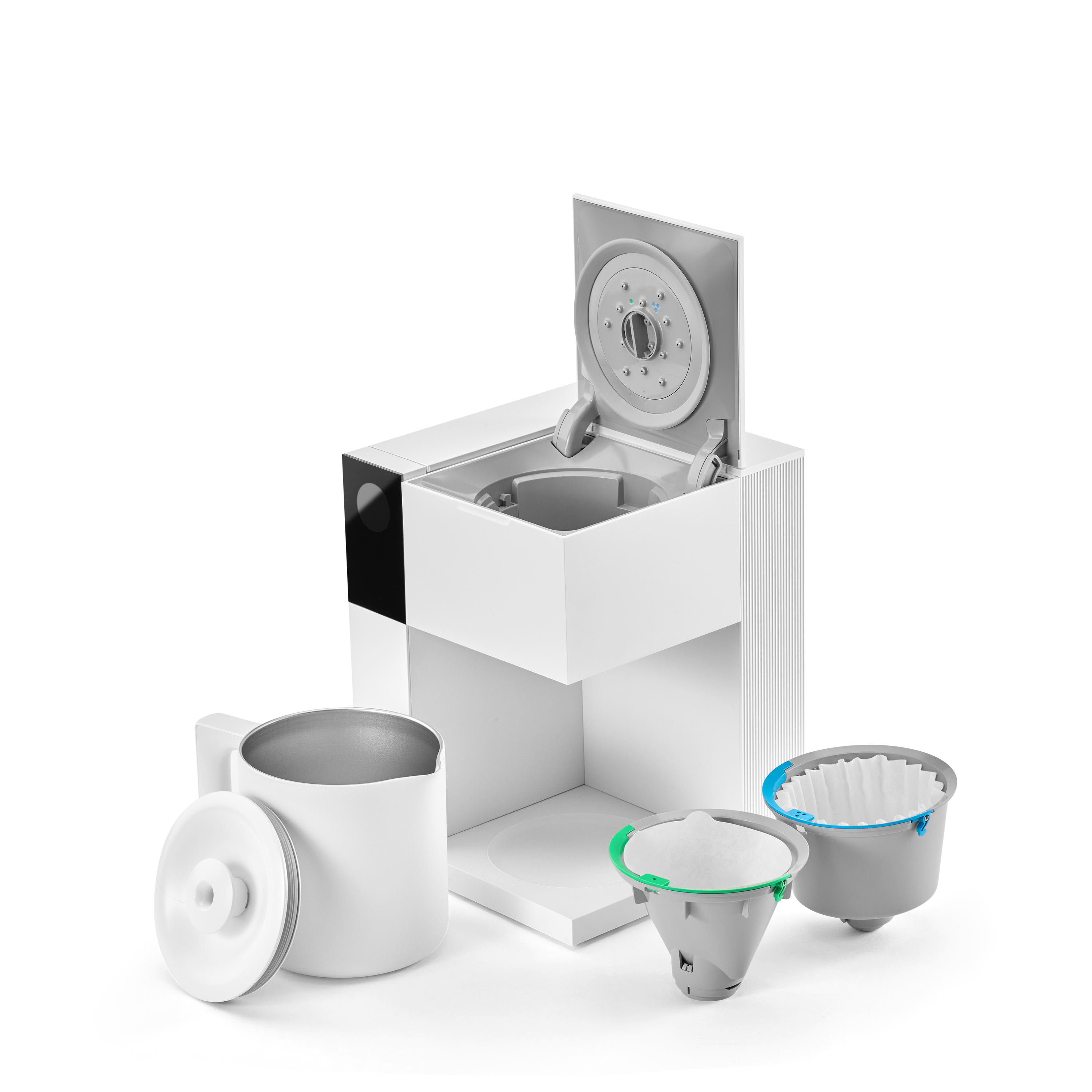 White compact coffee maker with a hinged lid, a stainless steel cup, and two reusable coffee filters.