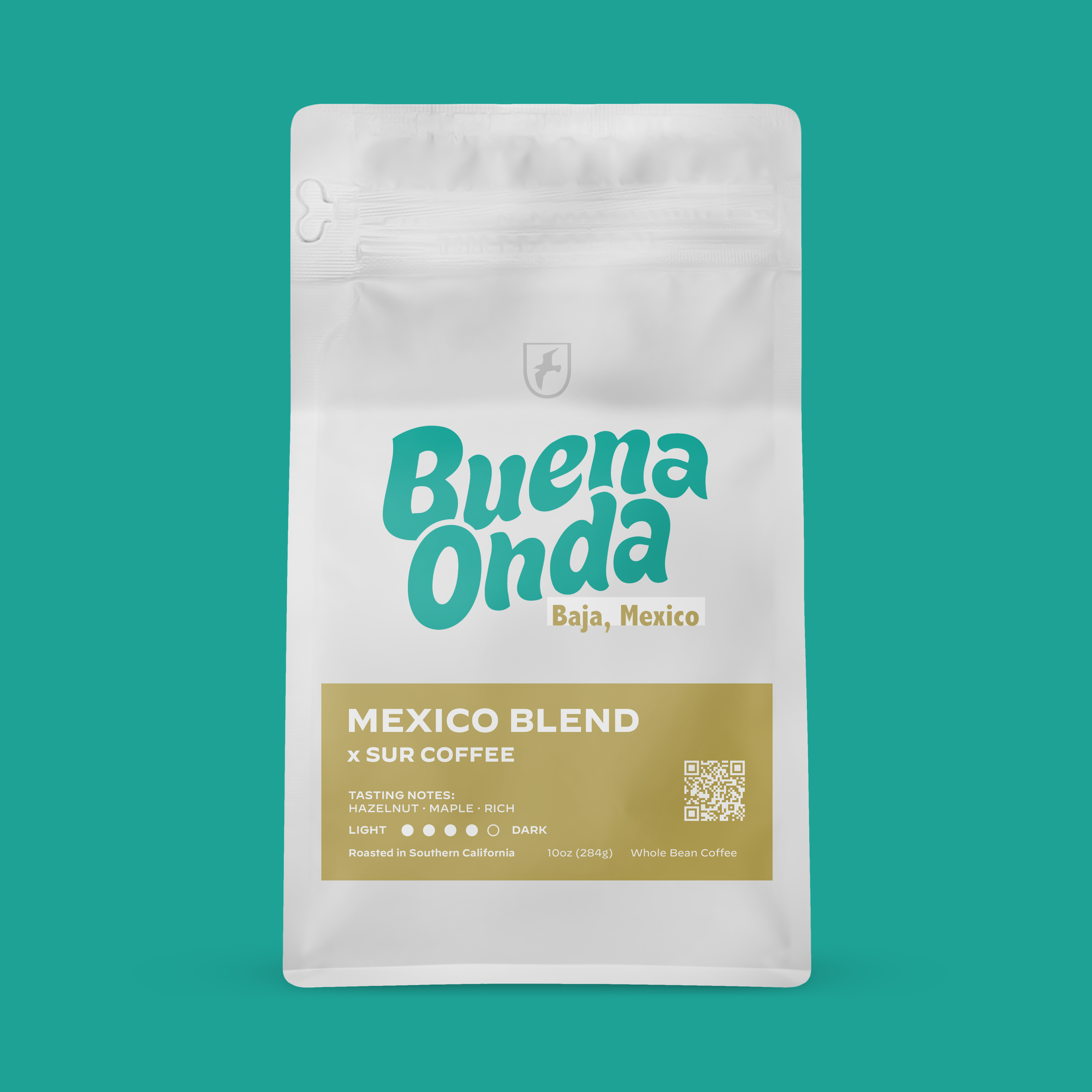 White resealable coffee bag with turquoise "Buena Onda" logo and gold label reading "Mexico Blend x Surf Coffee".
