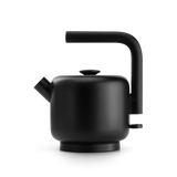 Matte black electric kettle with a cylindrical body and large angled handle.