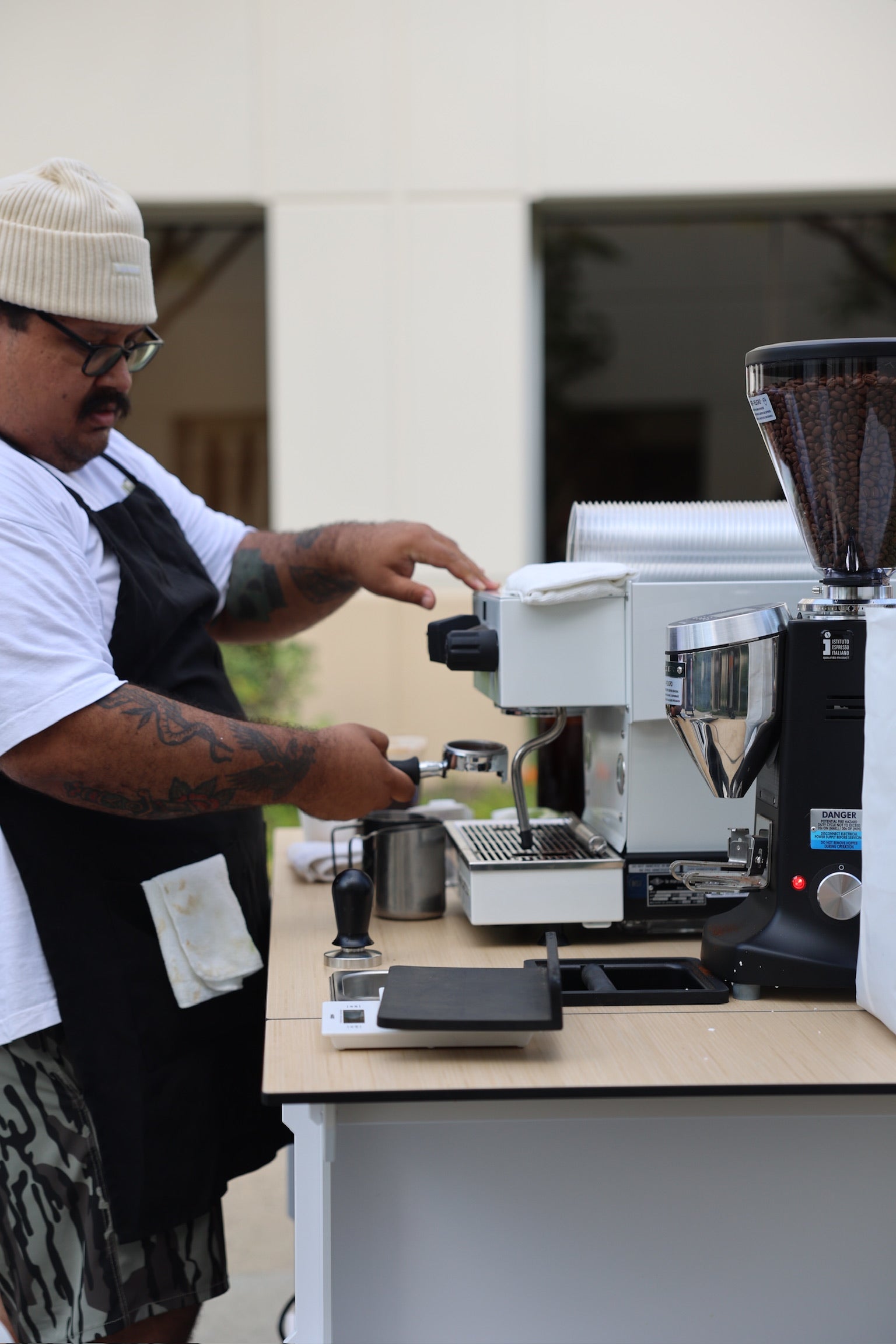 Coffee cart with man pulling espresso shot