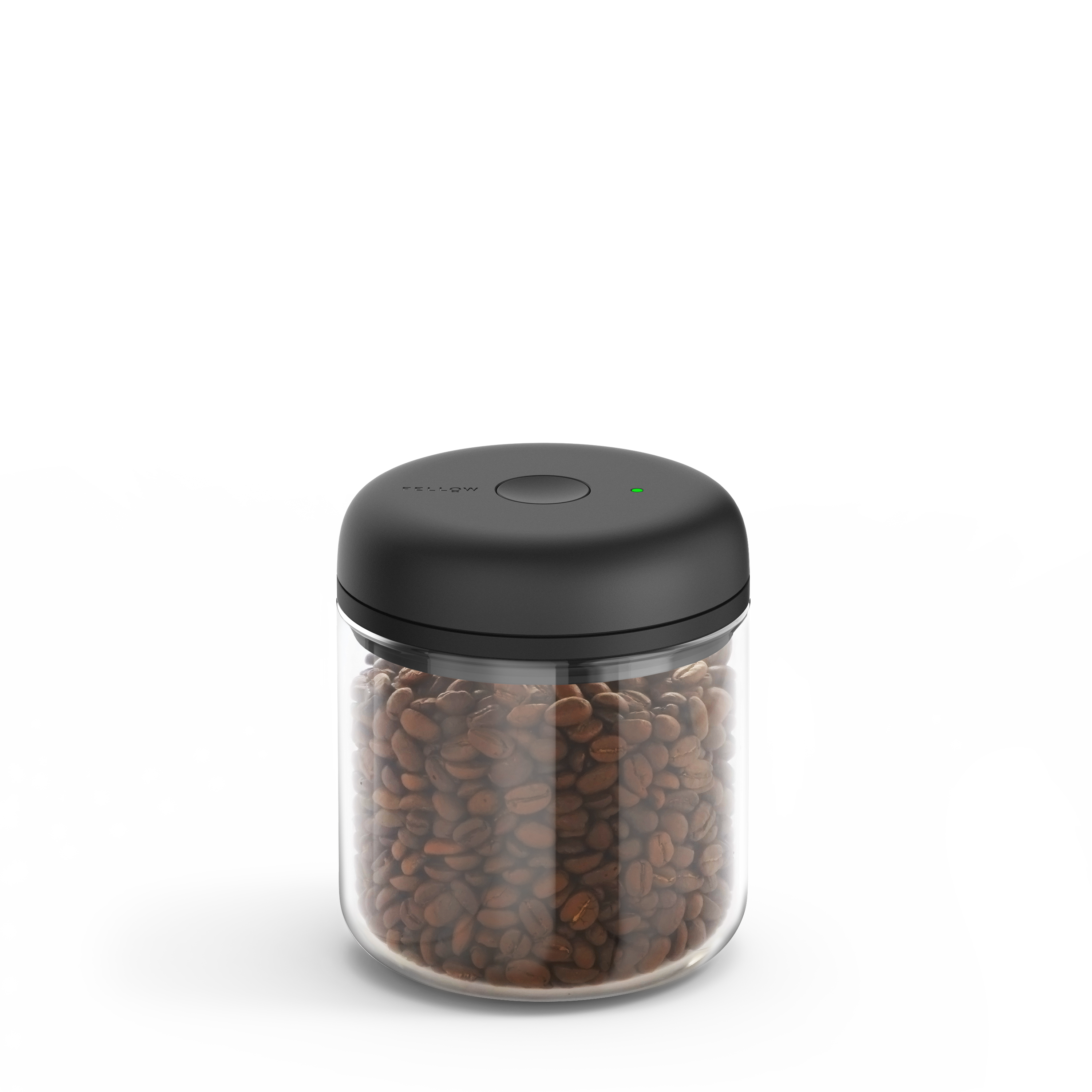 Clear cylindrical glass canister with a matte black lid and filled with coffee beans.