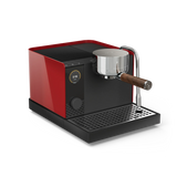 Compact espresso machine with glossy red sides, black front, digital display, and wooden-handled portafilter.