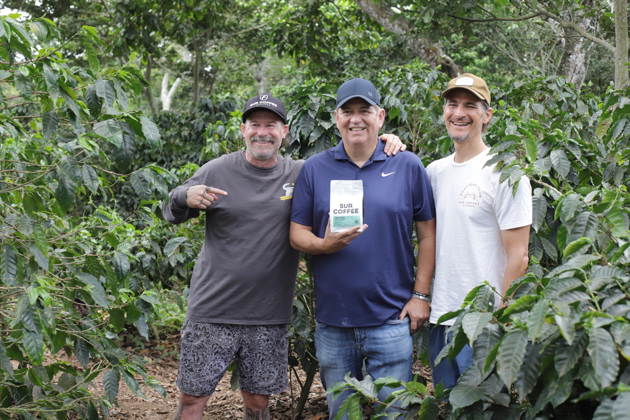 Founders smiling at the coffee grower