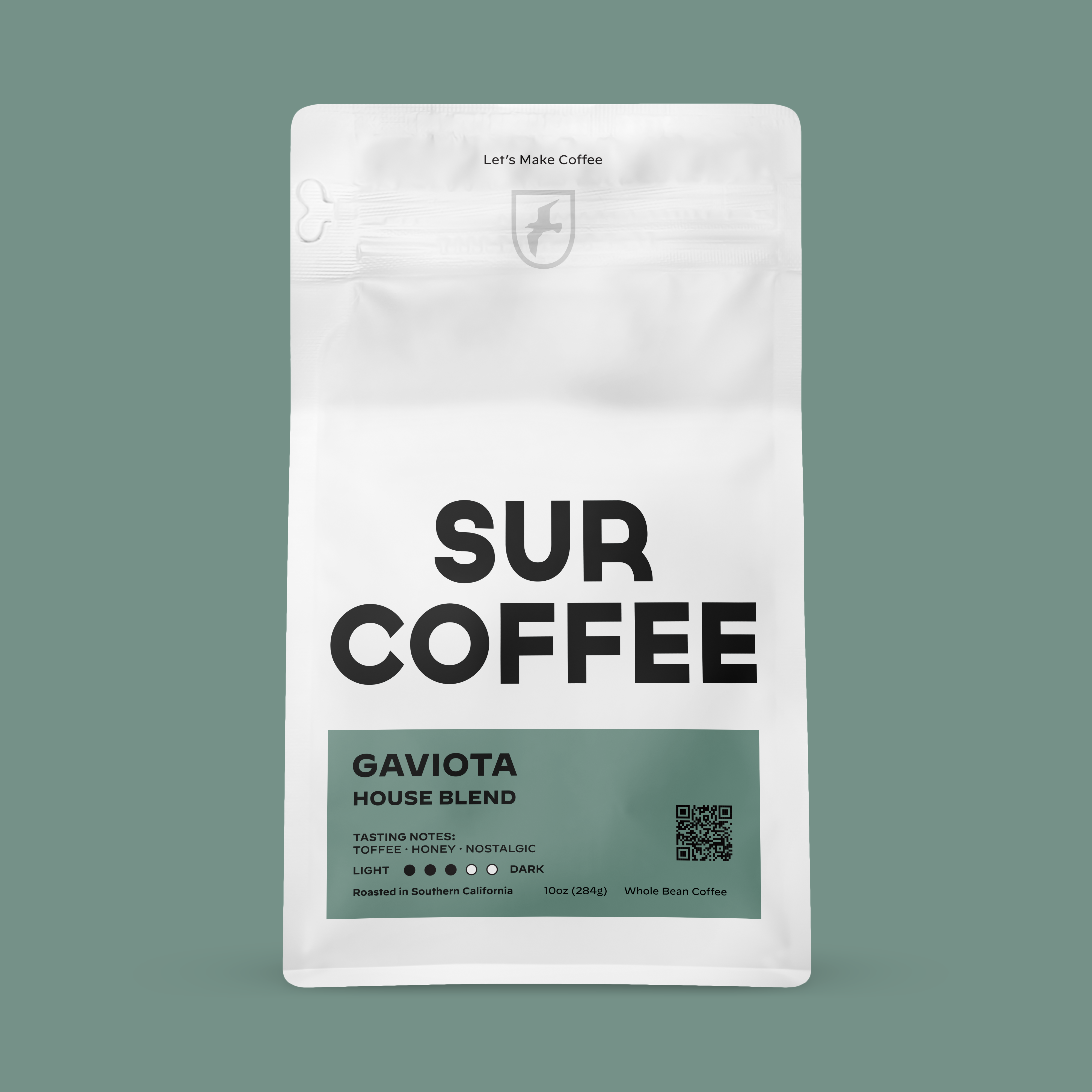 White resealable coffee bag with black "SUR COFFEE" text and teal label reading "Gaviota House Blend".