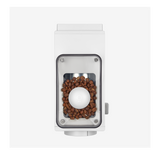 White rectangular coffee grinder with transparent hopper containing brown coffee beans on top view.