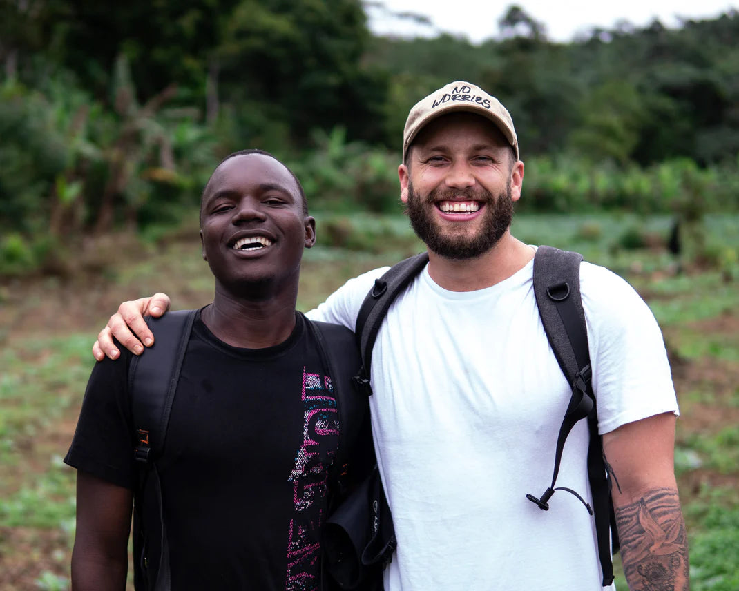 Roaster team smiling with farmers