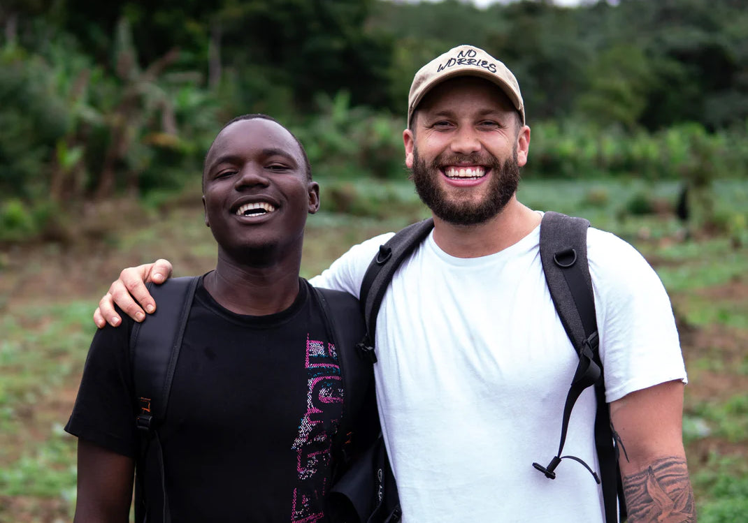 Roaster team smiling with farmers