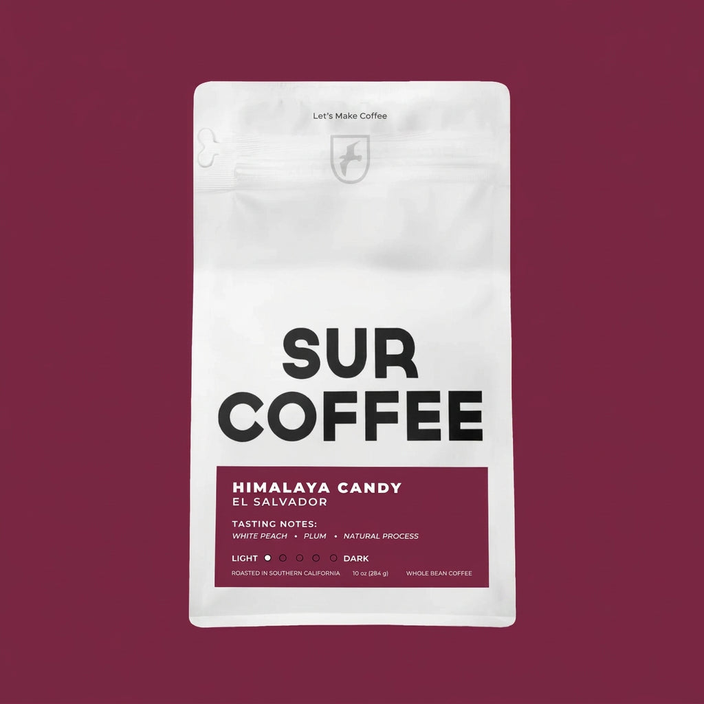 White resealable coffee bag with black "SUR COFFEE" text and maroon label detailing "Himalaya Candy El Salvador" blend.