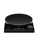 Black circular precision scale with digital display and control knob on a square base.