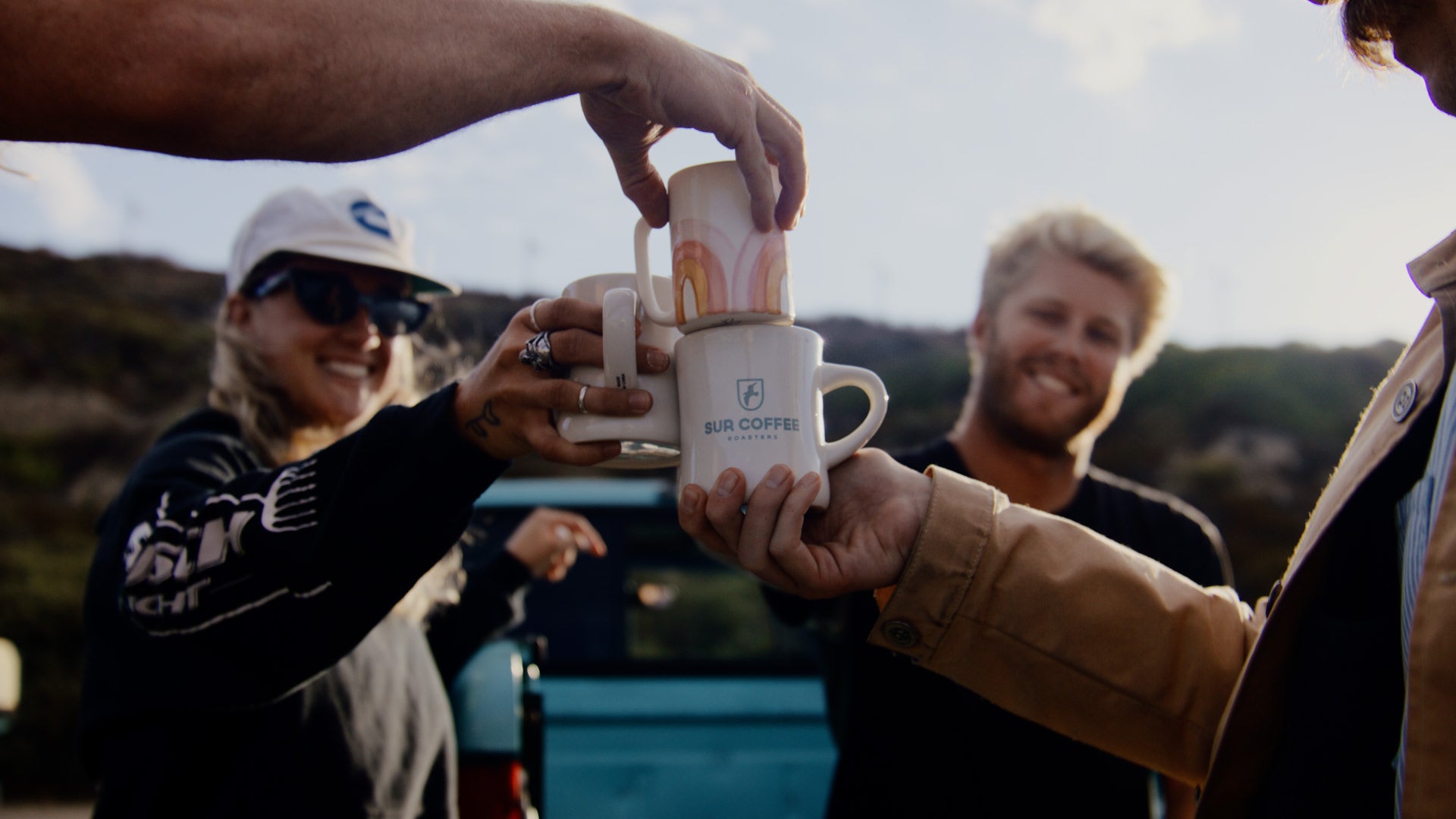 people knocking cups together